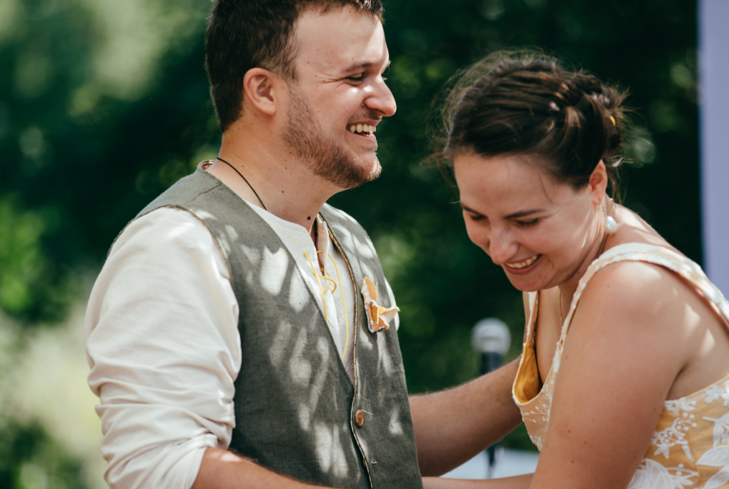 The brid and groom laughing together